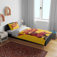 Yellow duvet and pillows with red diagonal stripes, bull graphic, crown, and ESPANA