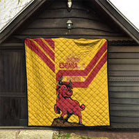 Quilt with yellow Spanish flag design and red bull graphic