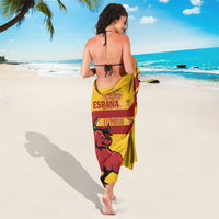 Yellow Spain sarong draped on body with red stripes and bull emblem on back