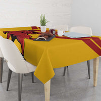 Yellow Spain tablecloth with bull graphic and red diagonal stripes, table setting view