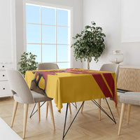 Yellow Spain tablecloth on dining table, bull graphic and red diagonal accents