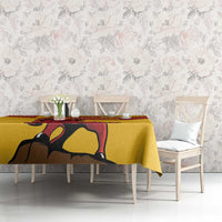 Yellow tablecloth with fighting bull and red diagonal stripes, chairs and table view