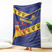 Blue Barbados blanket draped with lion crest, “BARBADOS” text, and floral graphic