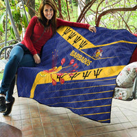 Blue Barbados quilt draped outdoors with yellow diagonal band, BARBADOS text, crest and flowers