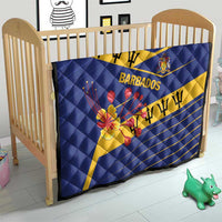 Blue Barbados quilt on crib with yellow diagonal band, BARBADOS text, coat of arms, flowers