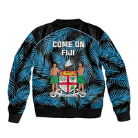 Black bomber jacket with blue palm-leaf print, back text 'COME ON FIJI' and crest