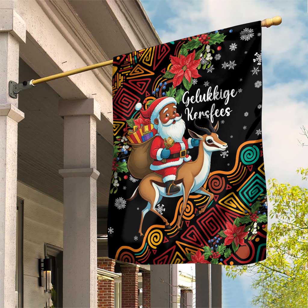 Black garden flag with Santa riding a springbok and “Gelukkige Kersfees” text