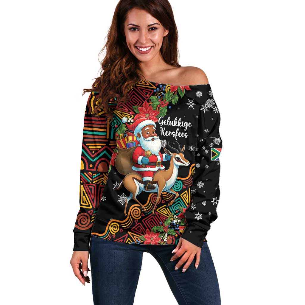 Black off-shoulder Christmas sweater with colorful Santa-and-reindeer graphic.