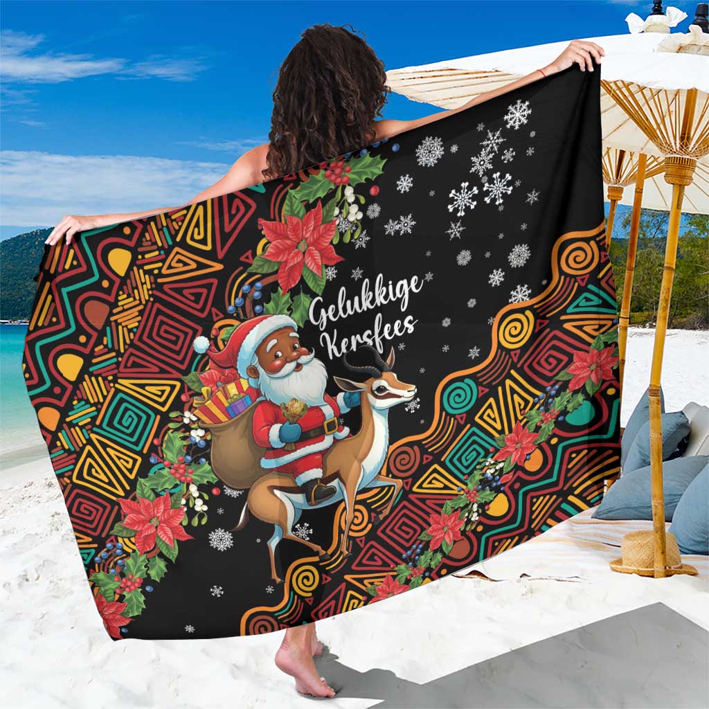 Black Christmas sarong featuring Santa riding a springbok with colorful swirls and flowers.