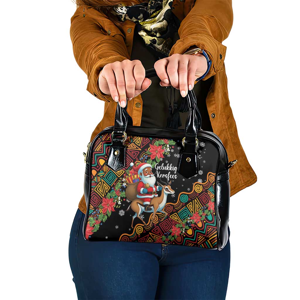 Black shoulder handbag with colorful holiday Santa and reindeer graphic, top handles