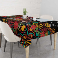 Christmas tablecloth with black background, colorful patterns, and poinsettias; table cover