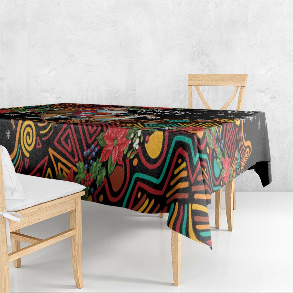 Christmas tablecloth with colorful geometric print and poinsettias; corner overhanging