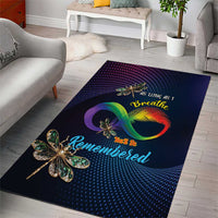 Dark blue rectangular area rug featuring rainbow infinity ring and dragonfly centerpiece