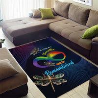 Dark blue area rug with rainbow infinity symbol and detailed dragonfly motif