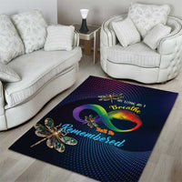 Dark blue rectangular area rug with rainbow infinity graphic and sparkling dragonflies