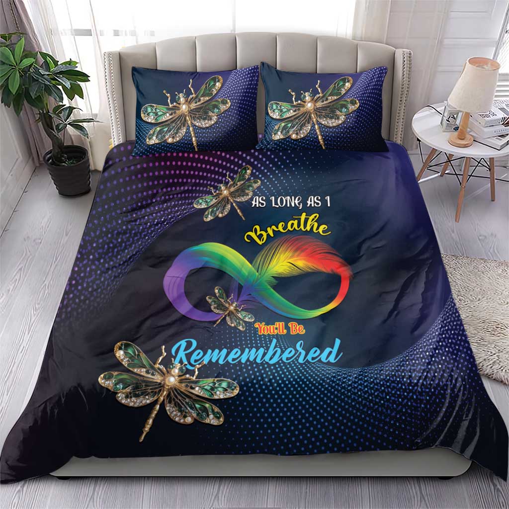 Navy duvet and two pillowcases with dragonfly artwork and rainbow heart graphic