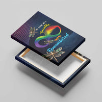 Framed canvas wall art viewed at an angle with rainbow infinity feather and dragonflies.