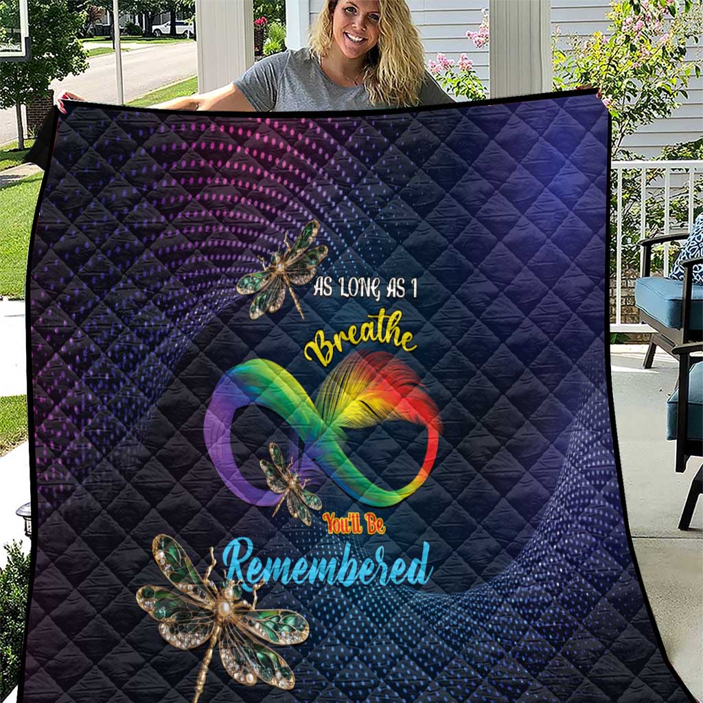 Navy quilt with diamond quilting, rainbow heart and dragonfly applique, text design