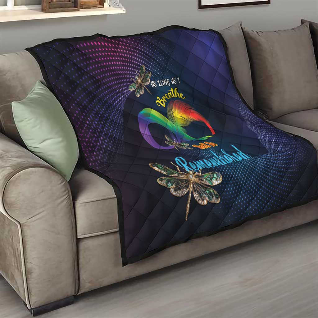 Navy quilt with diamond quilting and rainbow heart graphic, dragonfly applique foreground