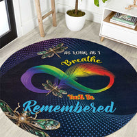 Round memorial carpet, dark navy with colorful infinity swirl and dragonfly print, round.