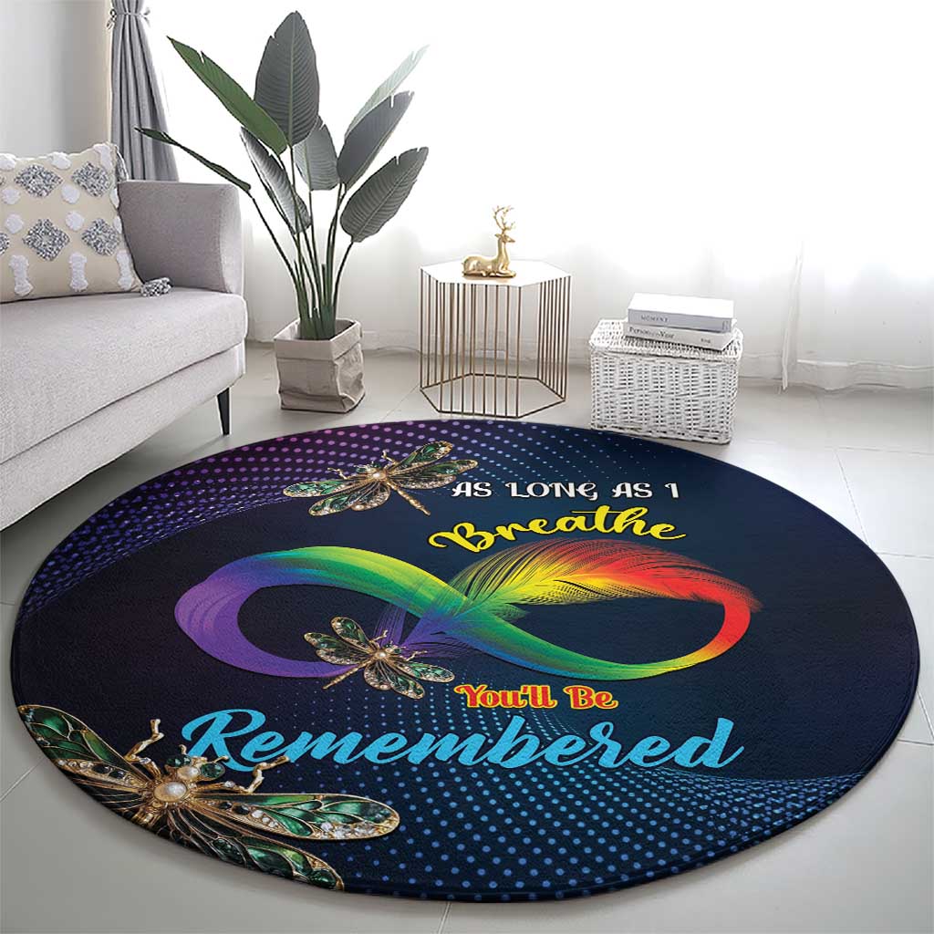 Round memorial carpet, dark navy with large rainbow infinity graphic and gold dragonflies.