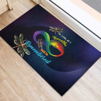 Colorful doormat with rainbow infinity heart, dragonfly icons, and Remembered script