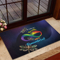 Colorful doormat with rainbow infinity heart and dragonfly decorations at entry