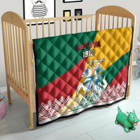 Lithuania Independence quilt on a baby crib with LIETUVA 1918 and knight banner
