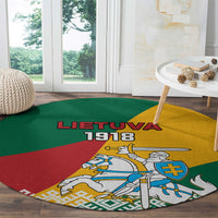 Round green-red-yellow carpet with Lietuva 1918 text and mounted knight emblem