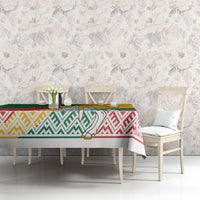 Lithuania tablecloth with crest panel and red, green, yellow stripes over dining furniture