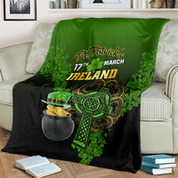 St. Patrick's Day blanket draped over couch, green/black Ireland text, shamrock and coin pot