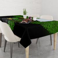 Rectangular black and green St. Patrick's tablecloth with shamrock border across center