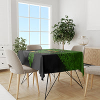 Rectangular black and green shamrock St. Patrick's tablecloth on dining table