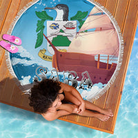 Round blue beach blanket with sailboat scene and SABA lettering, white fringe border.