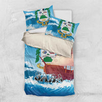 Blue bedding set with sailboat and waves print, folded duvet and two pillows