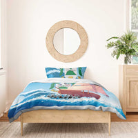 Blue comforter with sailboat, waves, and 'SABA' print with two pillowcases