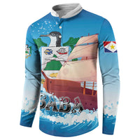 Blue button-front sweatshirt with sailboat bird graphic, 'SABA' lettering, and sleeve flag patch