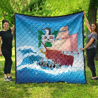 Blue quilt blanket featuring sailboat and waves with “SABA” text, shown outdoors