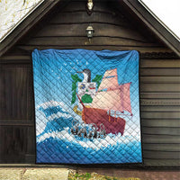 Blue quilt blanket hung in a porch opening with sailboat, waves, bird, and “SABA”