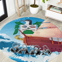 Round sailboat themed carpet rug in blue with “SABA” lettering and waves