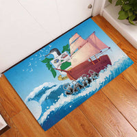 Blue rubber doormat with sailboat and waves design; bird figure and 'SABA' lettering