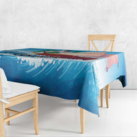 Blue sailboat tablecloth shown on a bench, featuring sailboats and ocean wave artwork
