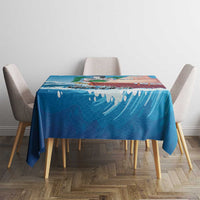 Blue sailboat tablecloth on a square table with matching chairs, wave and sailboat print