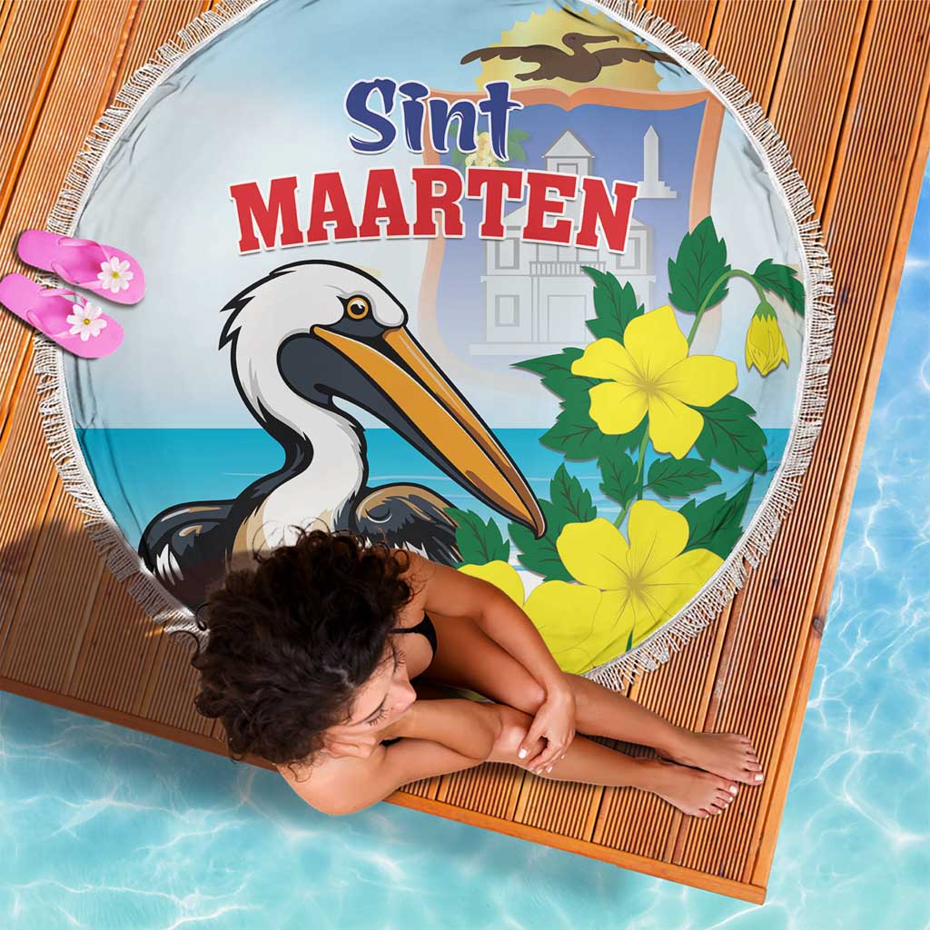 Round beach blanket with fringe, blue pelican and yellow flowers, 'Sint Maarten' text