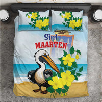 Blue bedding set with pelican, yellow flowers, and Sint Maarten text on duvet and pillows