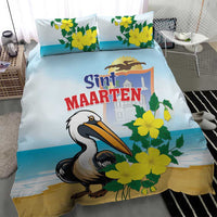 Blue bedding set featuring a pelican and yellow flowers with Sint Maarten text on duvet