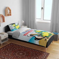 Blue bedding on a bed: duvet with pelican and yellow flowers, two matching pillowcases
