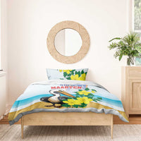 Blue duvet and pillow set featuring pelican with yellow flowers and Sint Maarten text