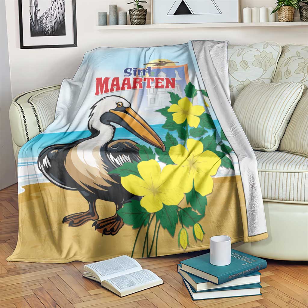 Light blue and tan blanket with pelican and yellow flowers, Sint Maarten text design