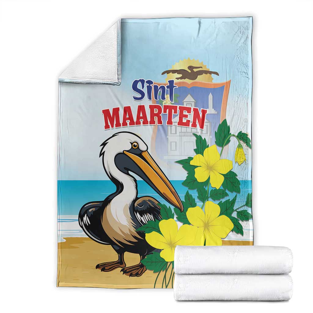 Folded light blue and tan blanket with pelican and yellow flowers, Sint Maarten design